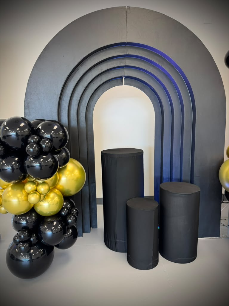 Black arch backdrop and display pedestals